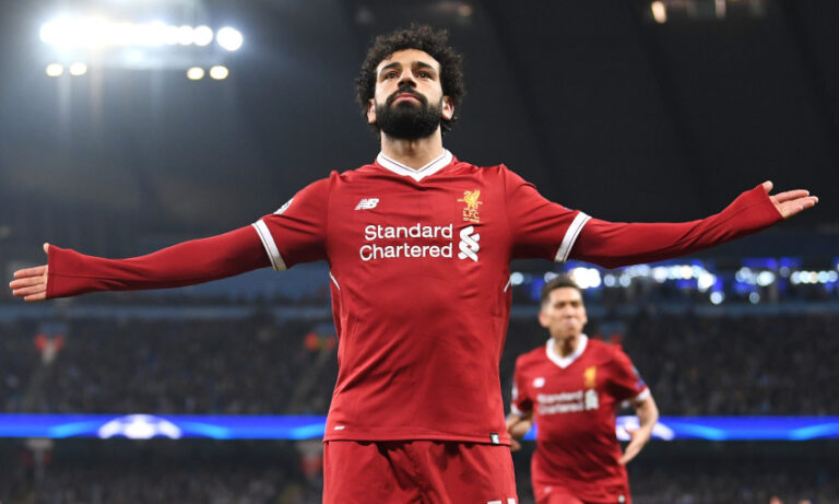 Mohamed Salah célèbre un but avec Liverpool, symbole de sa carrière exceptionnelle et de ses nombreux buts marqués